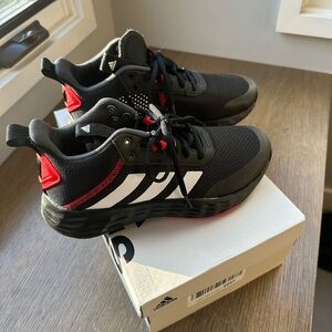 Never worn kids Adidas “Own the Game.” Black with red & white highlights.